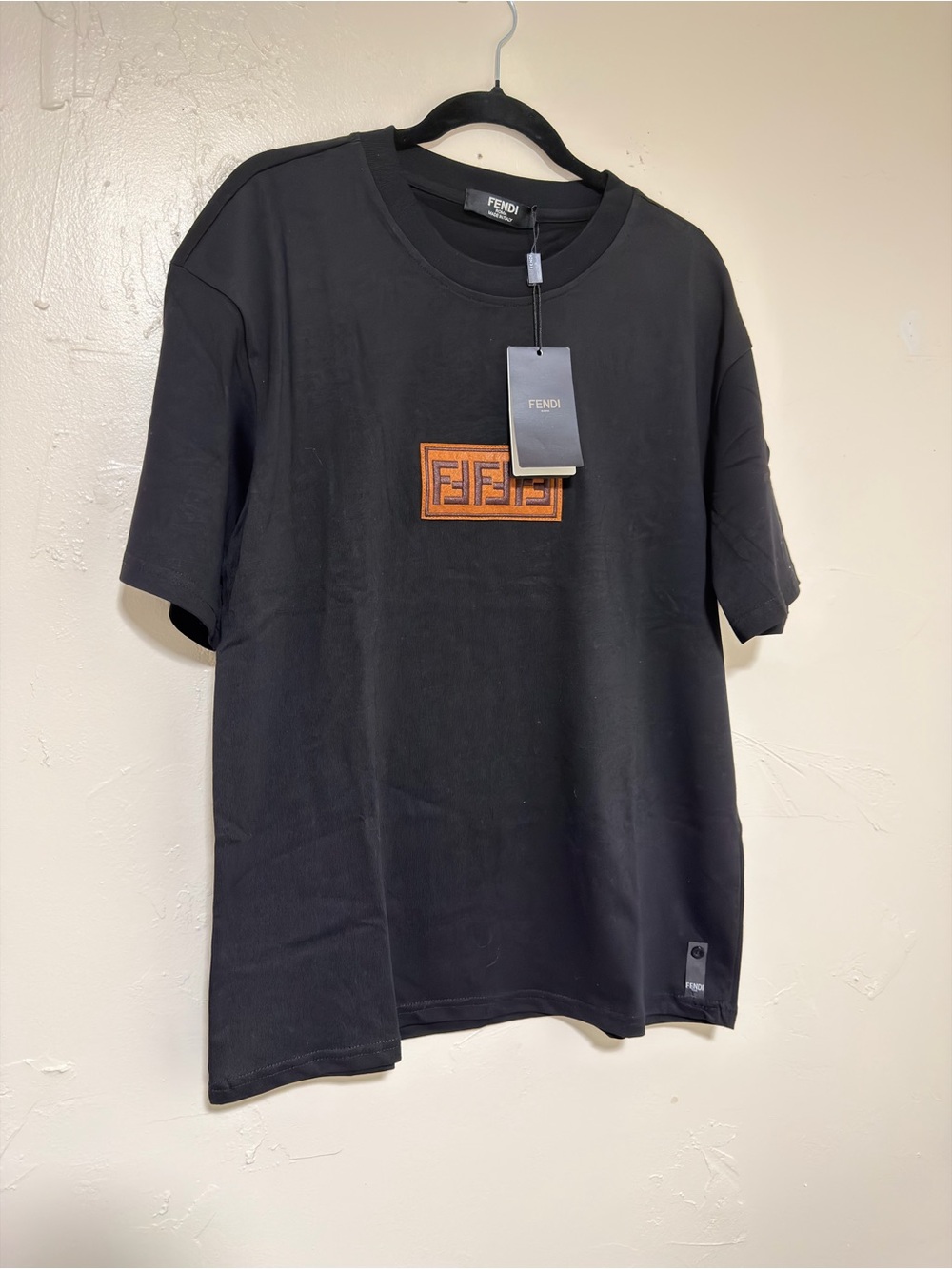 Black Short-Sleeve T-Shirt with Orange Logo Patch